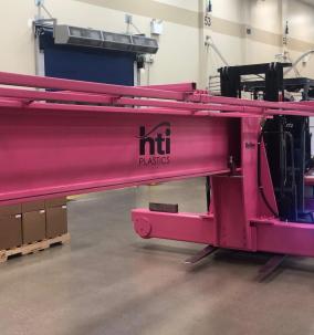 HTI PLASTICS INSTALLS PINK CRANE IN SUPPORT OF BREAST CANCER AWARENESS MONTH